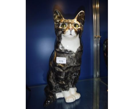 A WINSTANLEY CERAMIC MODEL OF A SEATED CAT