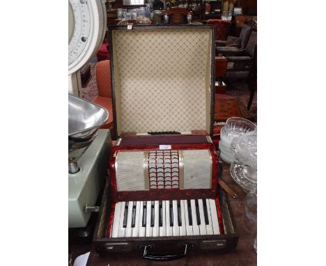 A VINTAGE PIANO ACCORDIAN 