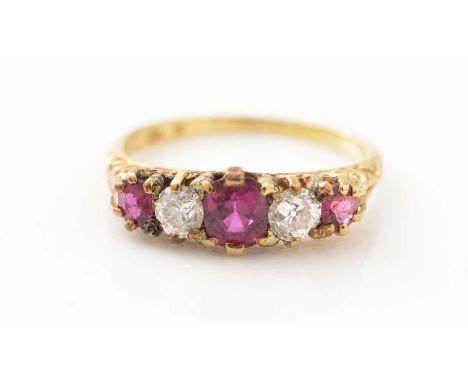 A Victorian ruby and diamond ring, the graduated oval facet cut rubies parted by old cut diamonds estimated to weigh a total 