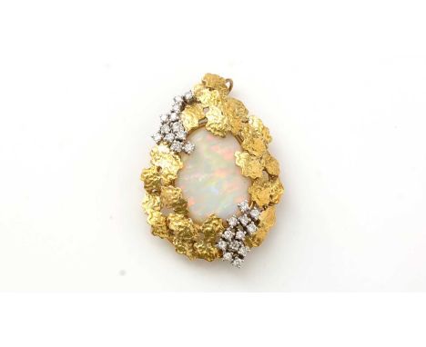 An opal and diamond pendant/brooch, the oval opal cabochon measuring approximately 28 x 22mm, the 18ct yellow gold textured m