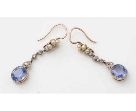 A fine pair of Victorian sapphire, diamond and seed pearl drop earrings, each set with an oval facet cut sapphire measuring a