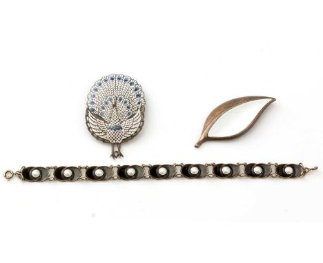 A Norwegian silver and enamel bracelet, with white and black enamel decoration, 18cms long; a Norwegian silver and white enam