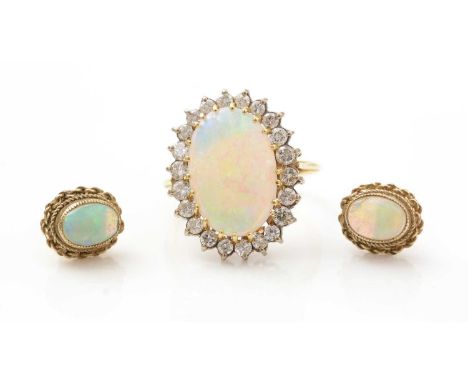 An opal and diamond cluster ring, the oval opal cabochon measuring 14.9 x 10.1mm surrounded by twenty-two brilliant cut diamo