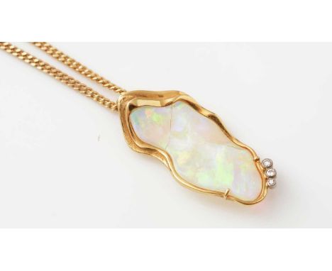 An opal and diamond pendant, the shaped opal in 18ct yellow gold mount set with three brilliant cut diamonds, 3.7 x 1.7mm, on