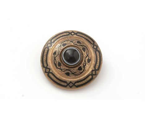 A Victorian Etruscan Revival mourning brooch, centred by banded agate cabochon, surrounded by black enamel leaf pattern desig