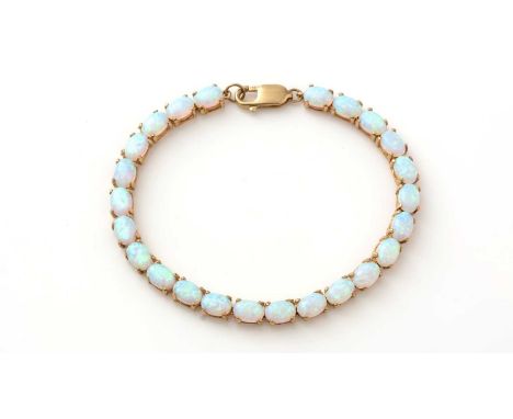 An opal bracelet, each link set with oval opal cabochon, each measuring approximately 7 x 5mm, in 9ct yellow gold mount, 19cm