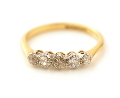 A five stone diamond ring, the graduated transitional brilliant cut diamonds weighing a total of approximately 0.50carats, in