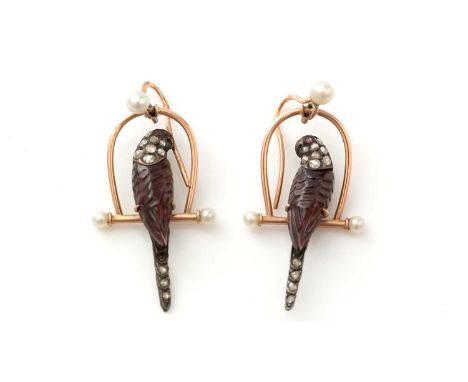 A fine and unusual pair of Victorian diamond and carved garnet parrot on perch pattern earrings, each set with carved garnet 