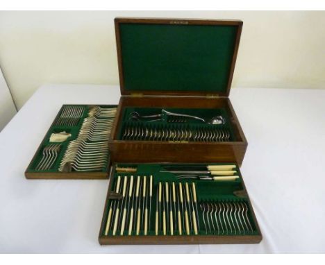 Maple and Co canteen of silver plated flatware with bone handles, 12 place setting in brass bound fitted case