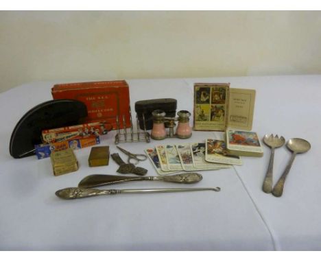 A quantity of collectable items to include opera glasses, salad servers, silver handled button hook and a shoe horn