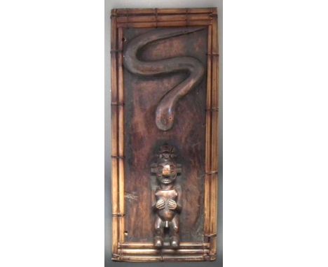 Large Yaka figure and snake panel, 95cm high    All lots in this Tribal and African Art Sale are sold subject to V.A.T. There