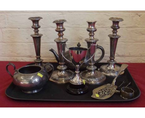 Set of four plated candlesticks, pewter tea pot and sugar basin, silver napkin ring, plated slice, pair of sugar tongs and a 