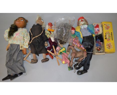 Collection of unusual vintage puppets including Pelham examples.