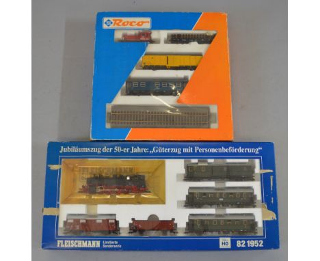 H0 Scale. Fleischmann. 50th Anniversary Limited Edition mixed traffic set, together with Roco freight set. VG in F/G boxes.
