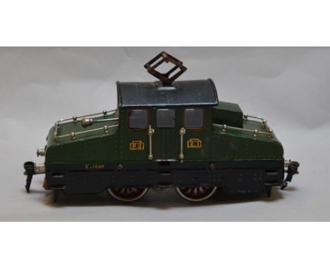 O Gauge. Marklin 3-rail E.1. steeple cab locomotive. Circa 1916. Rare item. Missing 1 wheel, lamp detached.