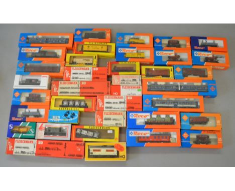 H0 Scale. Fleischmann, Roco, Lima, Marklin etc. 37 x assorted rolling stock. VG in F/G boxes.