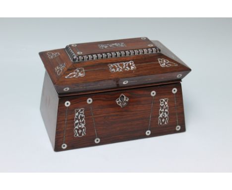 A ROSEWOOD SARCOPHAGUS SHAPED TEA CADDY, inlaid with mother-of-pearl, the hinged lid opening to a fitted two compartment inte