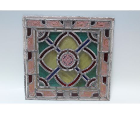 A 20TH CENTURY LEADED AND STAINED SQUARE GLASS PANEL, 41.2 x 42.4 cm, together with an oblong wooden framed leaded and staine