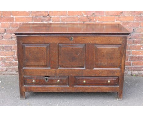 A 19TH CENTURY OAK MULE CHEST, the hinged lid above a three panel front with two short drawers below, raised on stile feet, H