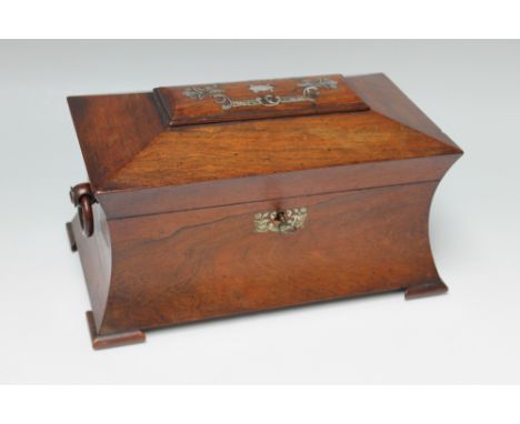 A 19TH CENTURY ROSEWOOD SARCOPHAGUS SHAPED TEA CADDY, the hinged lid with mother-of-pearl inlaid decoration, opening to revea