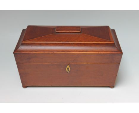A 19TH CENTURY MAHOGANY SARCOPHAGUS SHAPED TEA CADDY, the hinged lid opening to reveal a fitted interior with two tea caniste