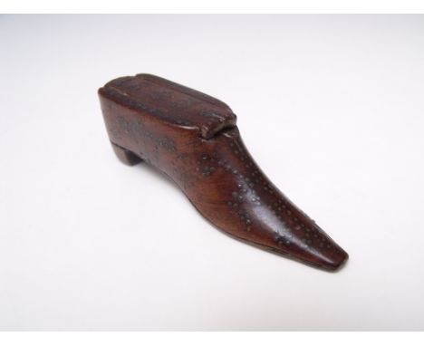 AN EARLY VICTORIAN SNUFF BOX IN THE FORM OF A BOOT, with a sliding lid, pin head decoration throughout, the lid depicting the