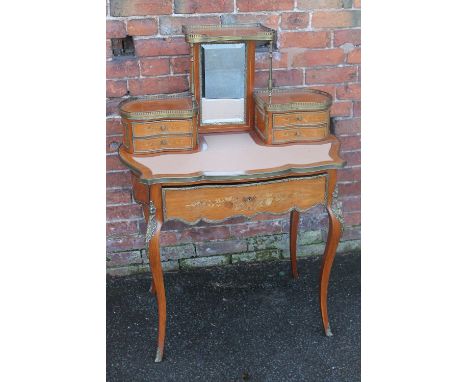 A FRENCH WALNUT BONHEUR DU JOUR, the superstructure with a central rectangular mirror flanked by two pairs of drawers, brass 