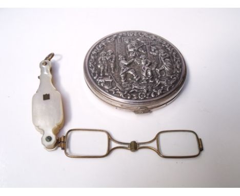 A CONTINENTAL SILVER AND WHITE METAL LADIES POWDER COMPACT, embossed and figural decoration to the hinged lid depicting a vil