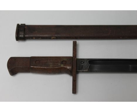 A WWII JAPANESE ARISAKA BAYONET WITH SCABBARD, clean blade with original finish, clear arsenal marks to forte, wood slab grip