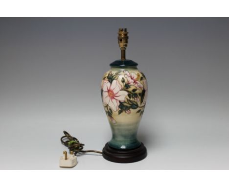 A LARGE MOORCROFT LAMP BASE 46/10, having typical floral decoration, H 39 cm Buyers - for shipping pricing on this lot, visit