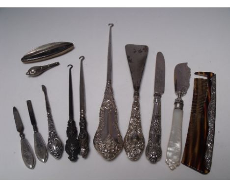 A SELECTION OF SILVER HANDLED VANITY / DRESSING TABLE ITEMS ETC., various dates and makers, to include three button hooks - o