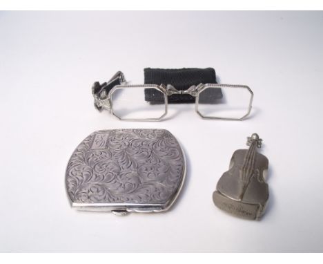A STERLING SILVER LADIES POWDER COMPACT, together with a pair of marcasite set folding lorgnettes, and a violin shaped vesta 