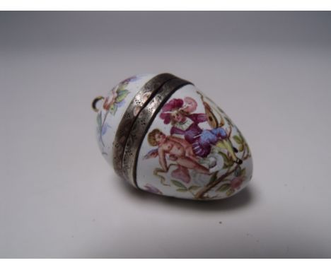 A CONTINENTAL ENAMEL EGG SHAPED PENDANT VINAIGRETTE, painted floral and figural decoration on a white background, gilt white 