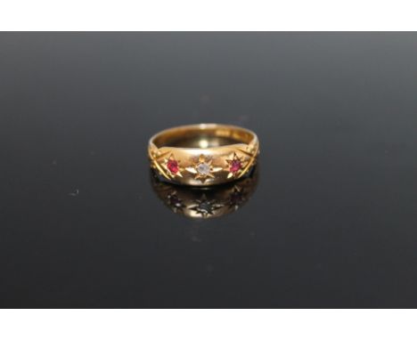 AN 18 CARAT YELLOW GOLD RUBY AND DIAMOND RING, ring size N 1/2 Buyers - for shipping pricing on this lot, visit www.cuttlesto