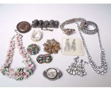 A COLLECTION OF VINTAGE SILVER AND COSTUME JEWELLERY ITEMS, comprising various brooches, earrings, and necklaces, together wi
