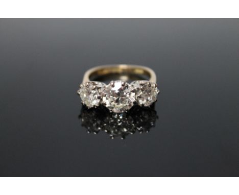 A THREE STONE BRILLIANT CUT DIAMOND RING OF APPROX 4.03CTS, the centre stone being just over 2 carats and is flanked by two s