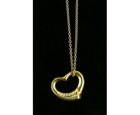 Tiffany &amp; Co. open heart pendant with diamonds, designed by Elsa Peretti, 18 ct gold open heart pendant is set with five 