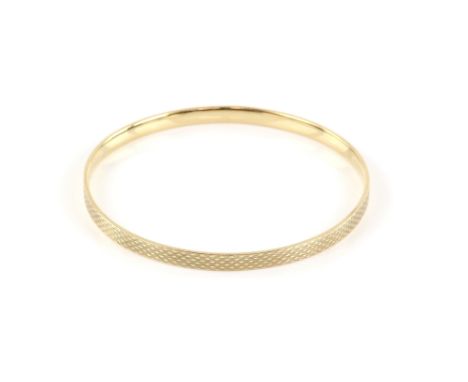 1920's flapper girl bangle, 5mm wide fixed gold bangle with an engine turned design to the outer edge, hallmarked Birmingham 
