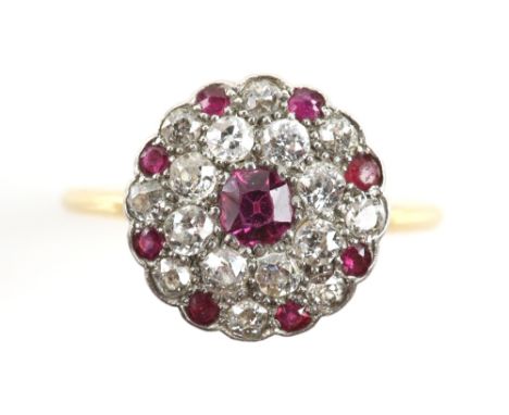 Antique ruby and diamond circular cluster ring, central octagonal cut ruby encompassed by a double halo of old cut diamonds, 