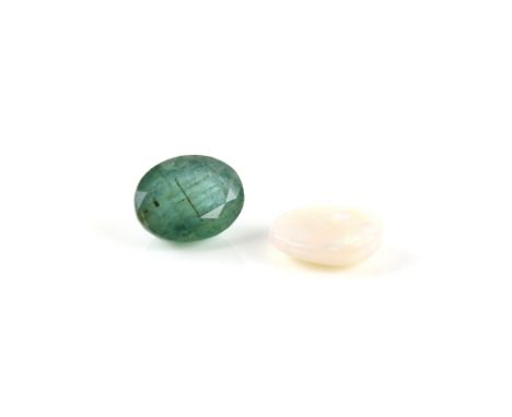 Loose oval cabochon cut opal, 11 x 9 x 3mm, and oval cut emerald, estimated weight 3.42 carats       Emerald measures approxi