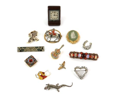 Art Deco travel clock, with a  silver lizard brooch set with synthetic ruby eyes and marcasite body, other gilt metal brooche