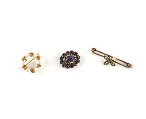 Three brooches, a Victorian foil backed amethyst and seed pearl brooch, testing as 15 ct, 1.7 x 2cm, a green enamel and seed 