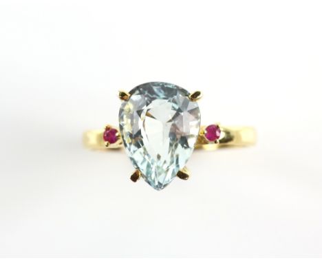 Aquamarine and ruby ring, pear shaped aquamarine, estimate weight 2.62 carats, flanked by round faceted rubies, claw set, mou