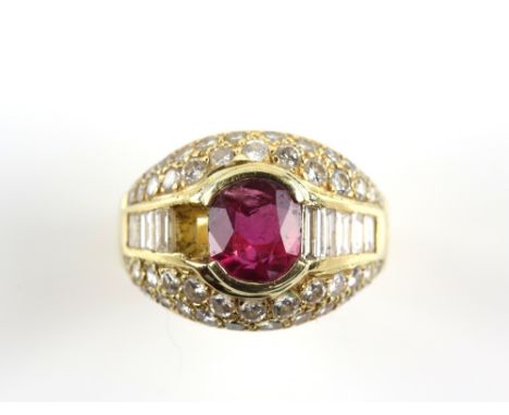 Ruby and diamond bombé dress ring, with a central oval cut ruby weighing an estimated 1.71 carats, surrounded by baguette and