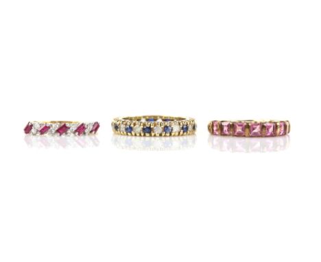 Three eternity rings, including a blue and white sapphire full eternity ring, ring size L, a ruby and diamond half eternity r