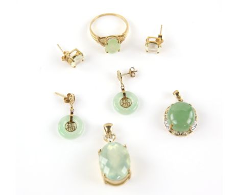 Two suites of jewellery, comprising an oval cabochon jade pendant, with a gold and diamond surround, together with a pair of 