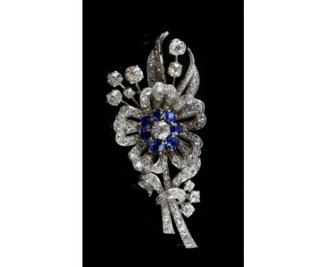 Late Art Deco sapphire and diamond floral spray brooch, central old European cut diamond weighing an estimated 0.85 carat, su