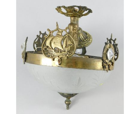 An Edwardian style gilt metal light fitting, applied with leaves, cut glass drops and stylised galleons, with a frosted cut g