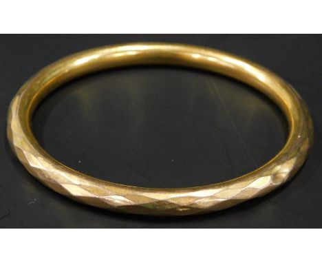 A 9ct gold hollow bangle, 18.9g all in. 