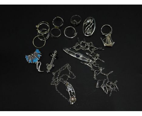 Various Arts and Crafts style brooches, to include Carrick Mackintosh style, Richard Bett sun ring, silver, etc.